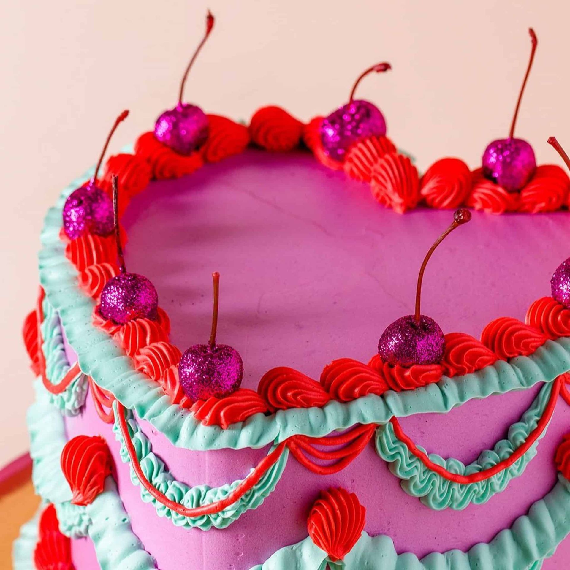 A man is kissing a woman who is holding a bouquet of flowers.