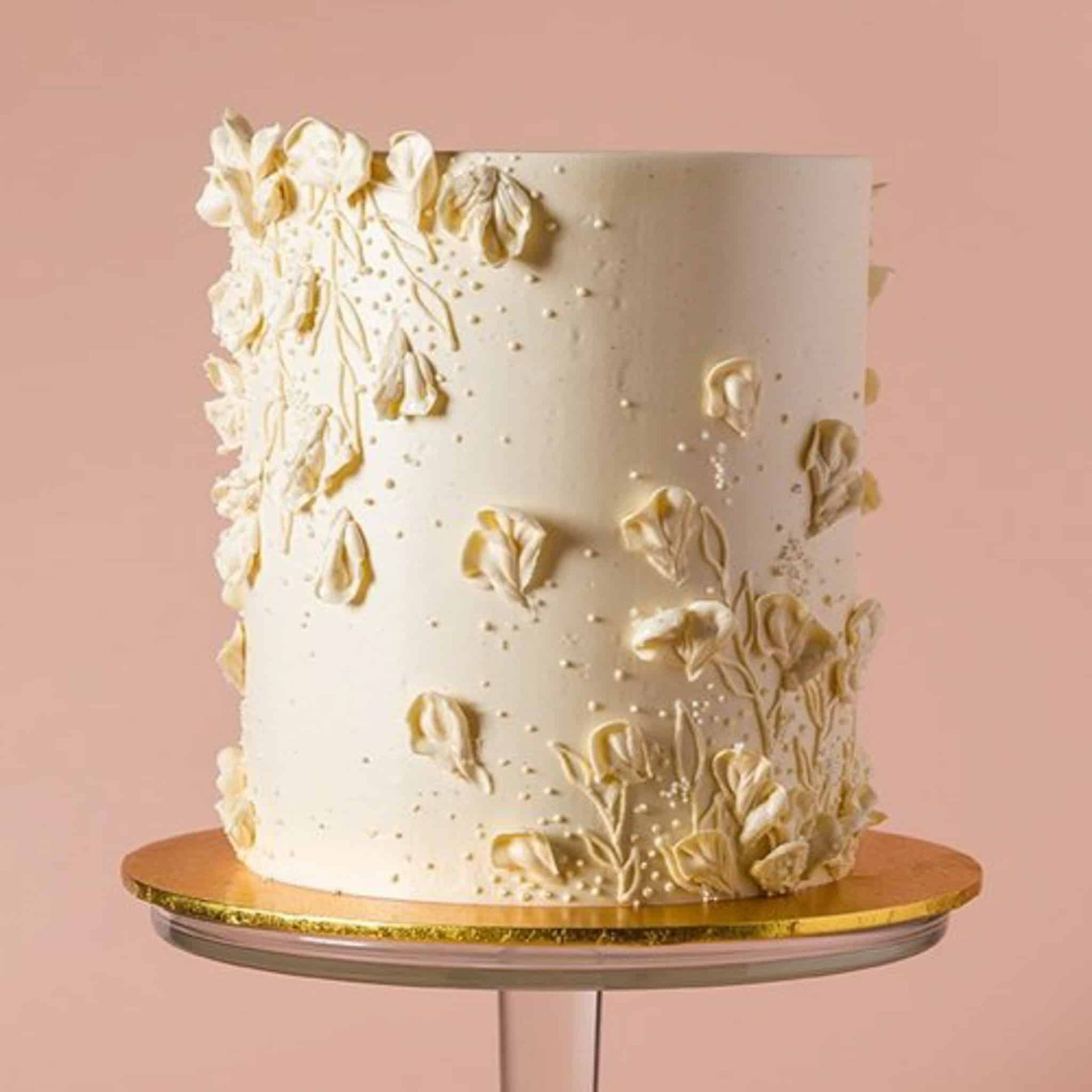 A woman in a black dress is holding a bouquet of flowers