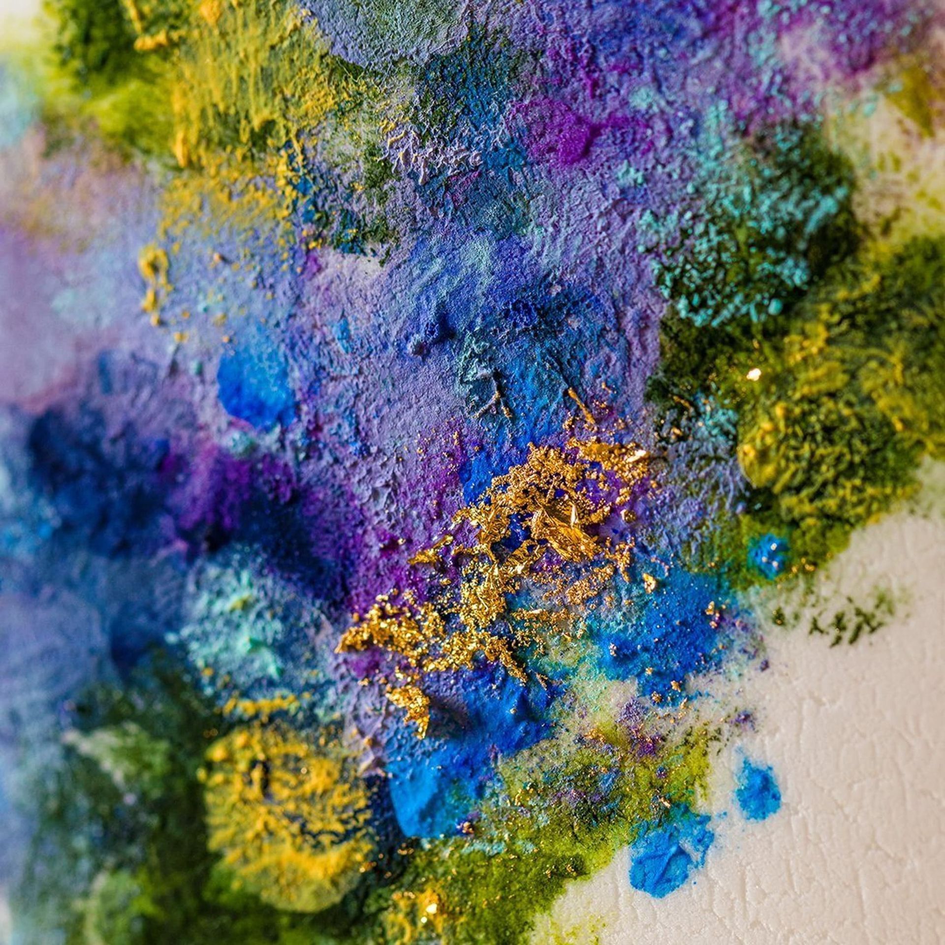 A woman in a blue dress is holding a bouquet of flowers.