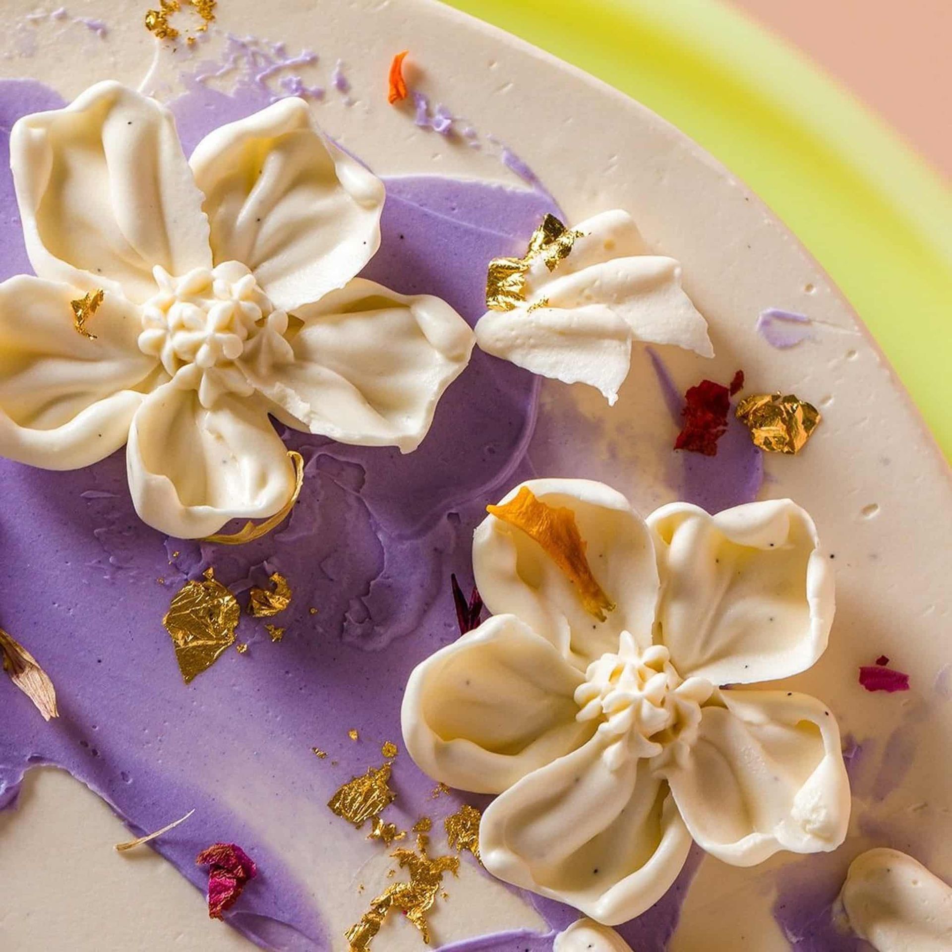 A woman in a white dress is holding a bouquet of white flowers.
