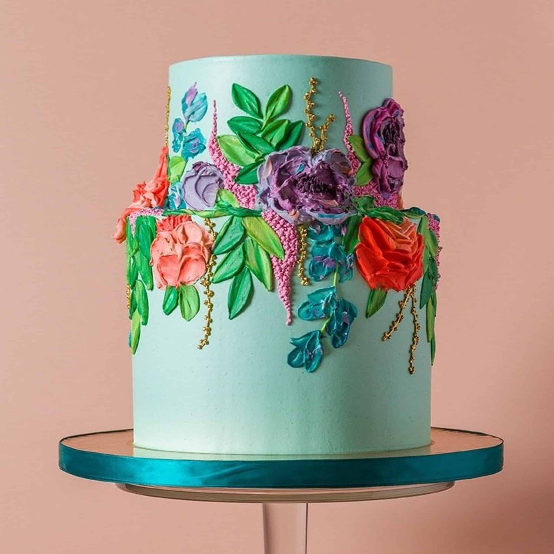 A close up of a bouquet of pink roses with a wedding ring in the middle.