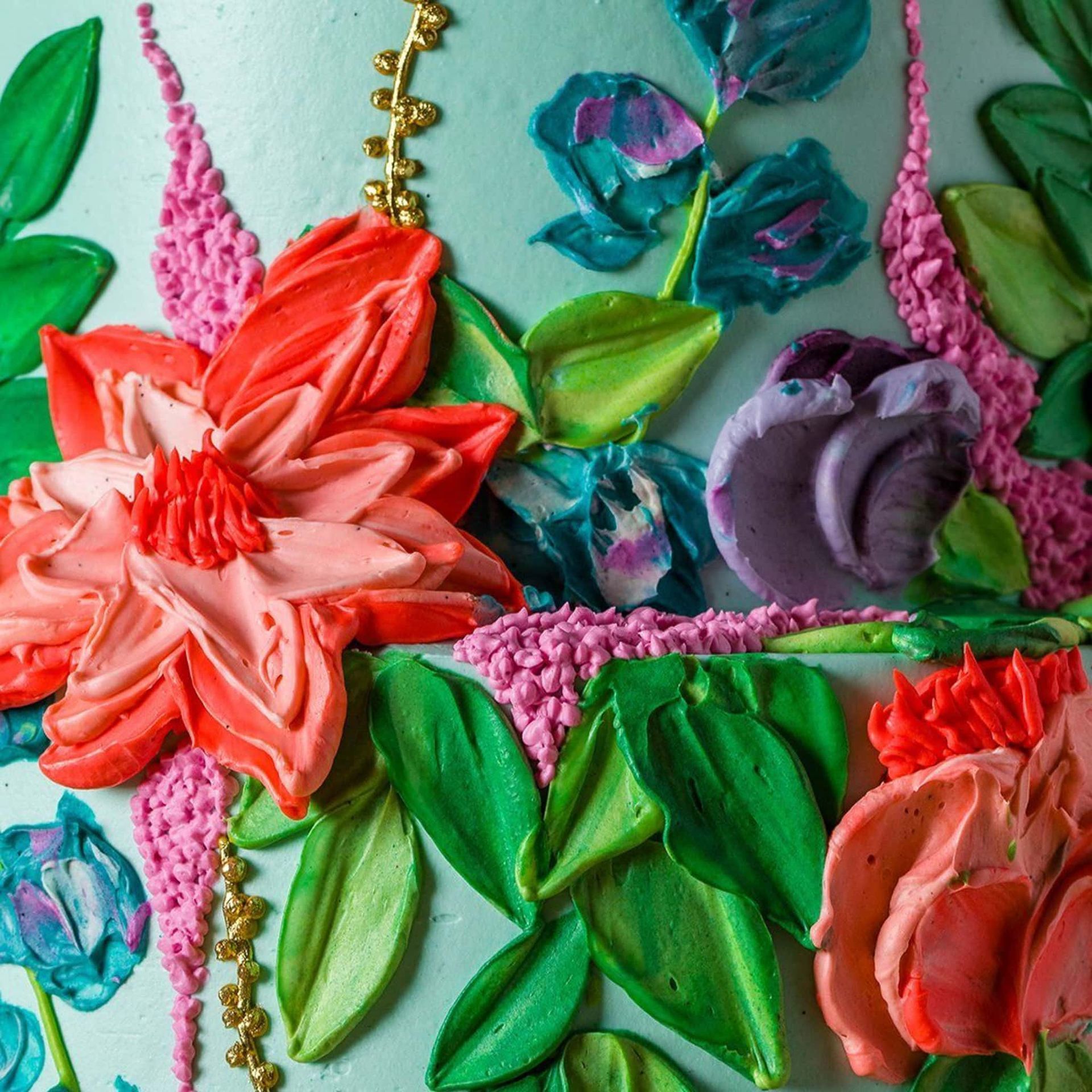 A woman in a white dress is holding a bouquet of flowers.