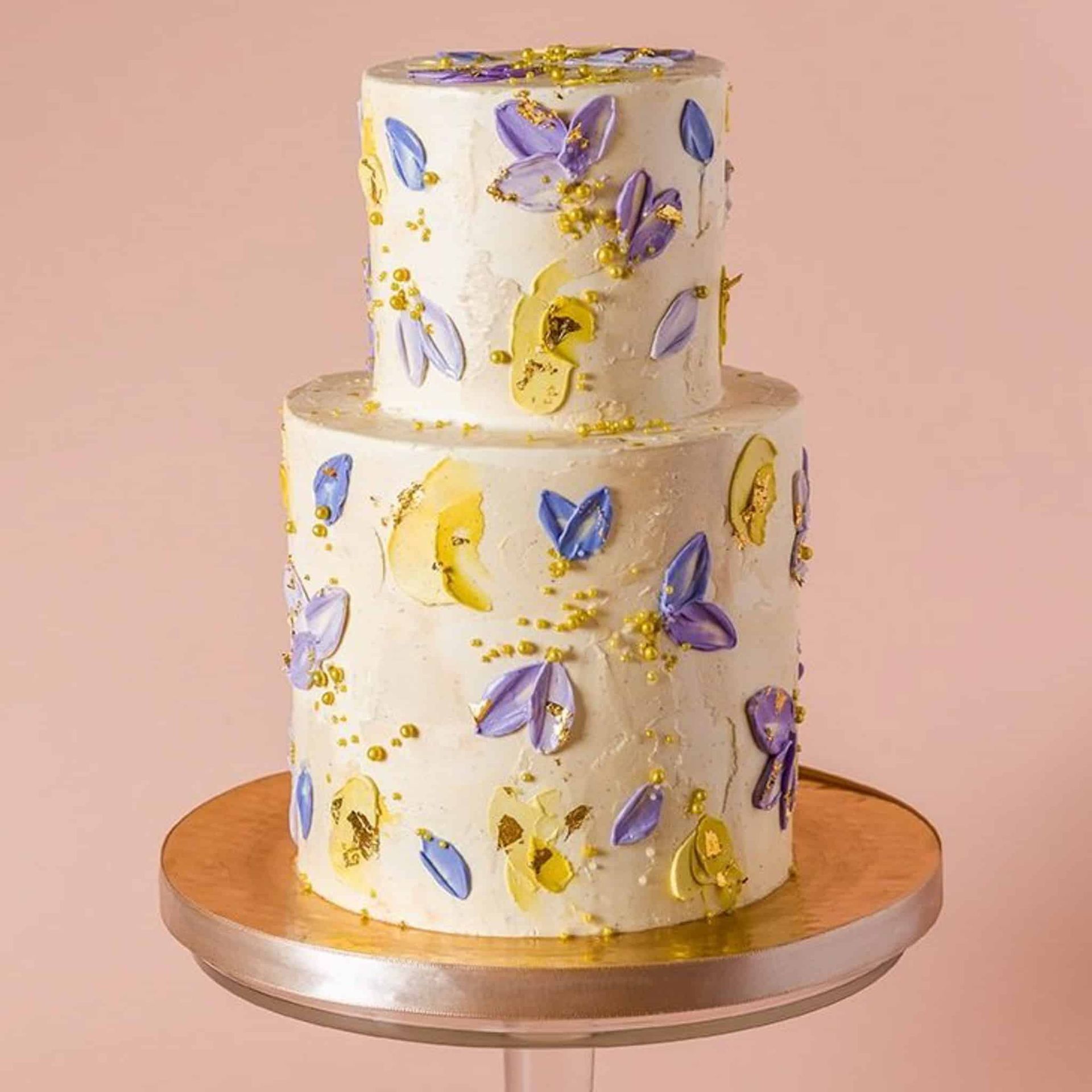 A woman in a wedding dress is holding a bouquet of flowers.