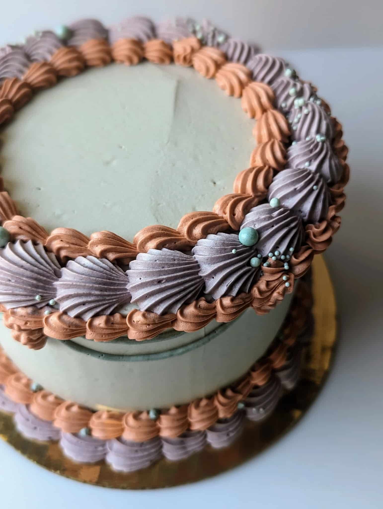 A bouquet of flowers is sitting on a table next to a chandelier.