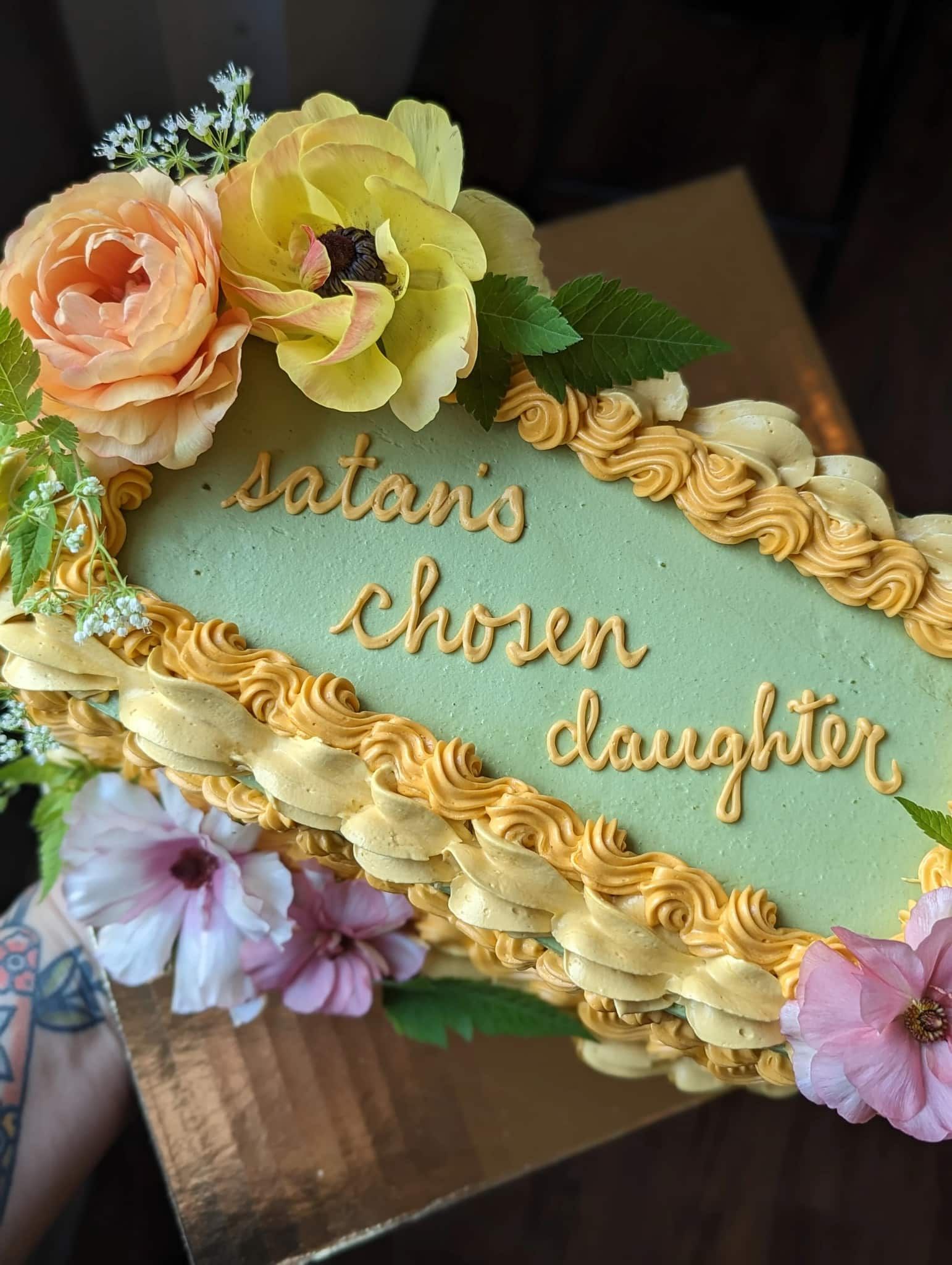 The bride is holding a bouquet of flowers in front of a mirror.