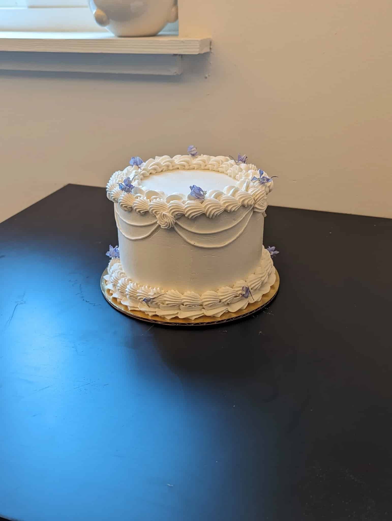 A woman in a wedding dress is holding a bouquet of flowers.