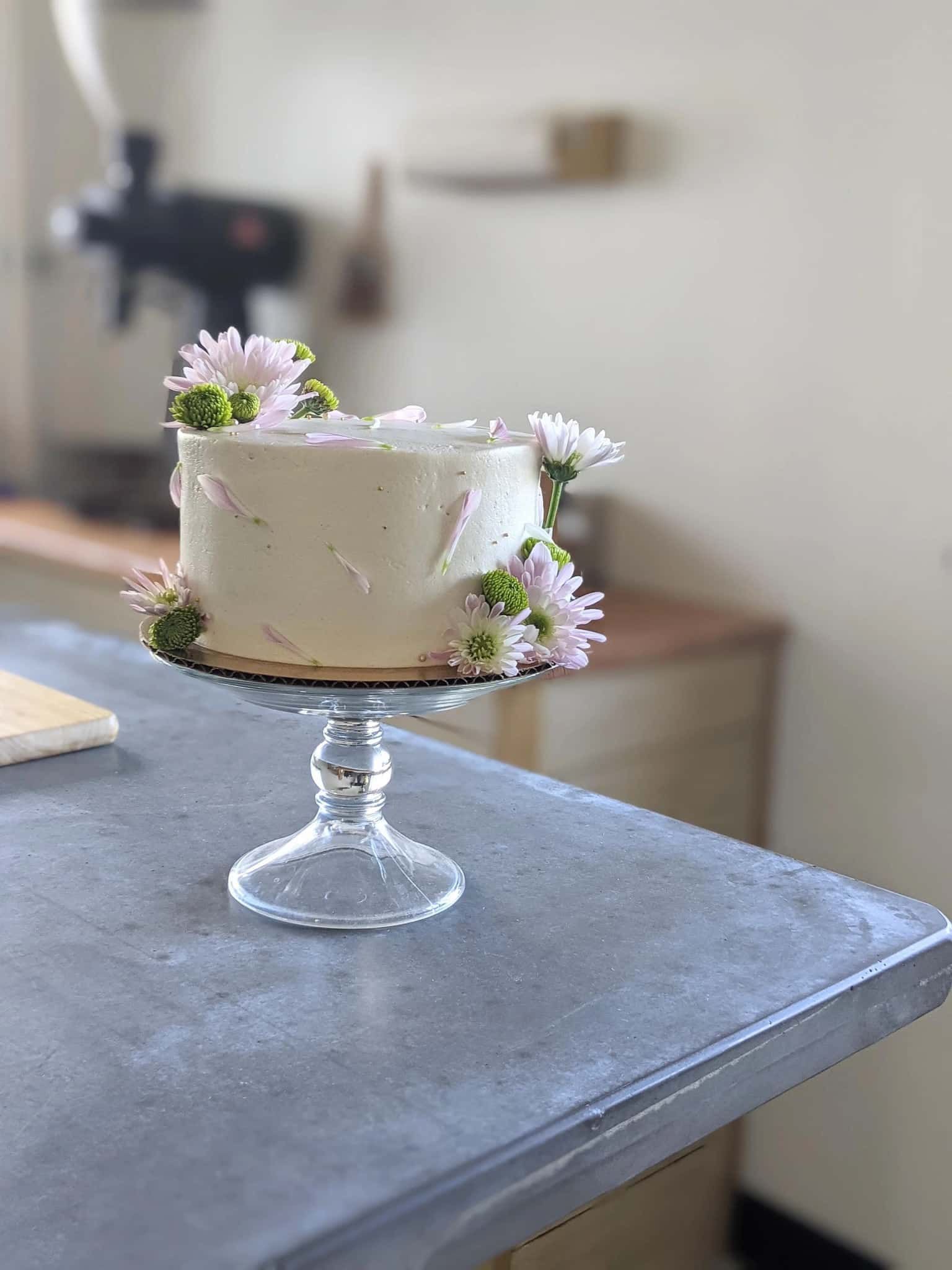 A woman in a white dress is holding a bouquet of flowers.