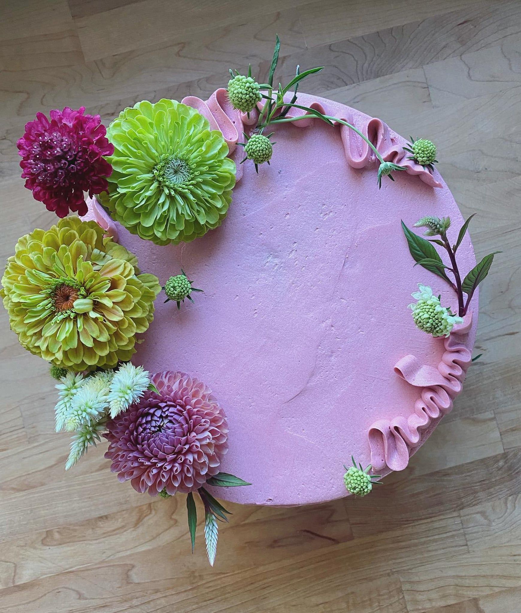 A bouquet of yellow and white flowers is sitting on a table.
