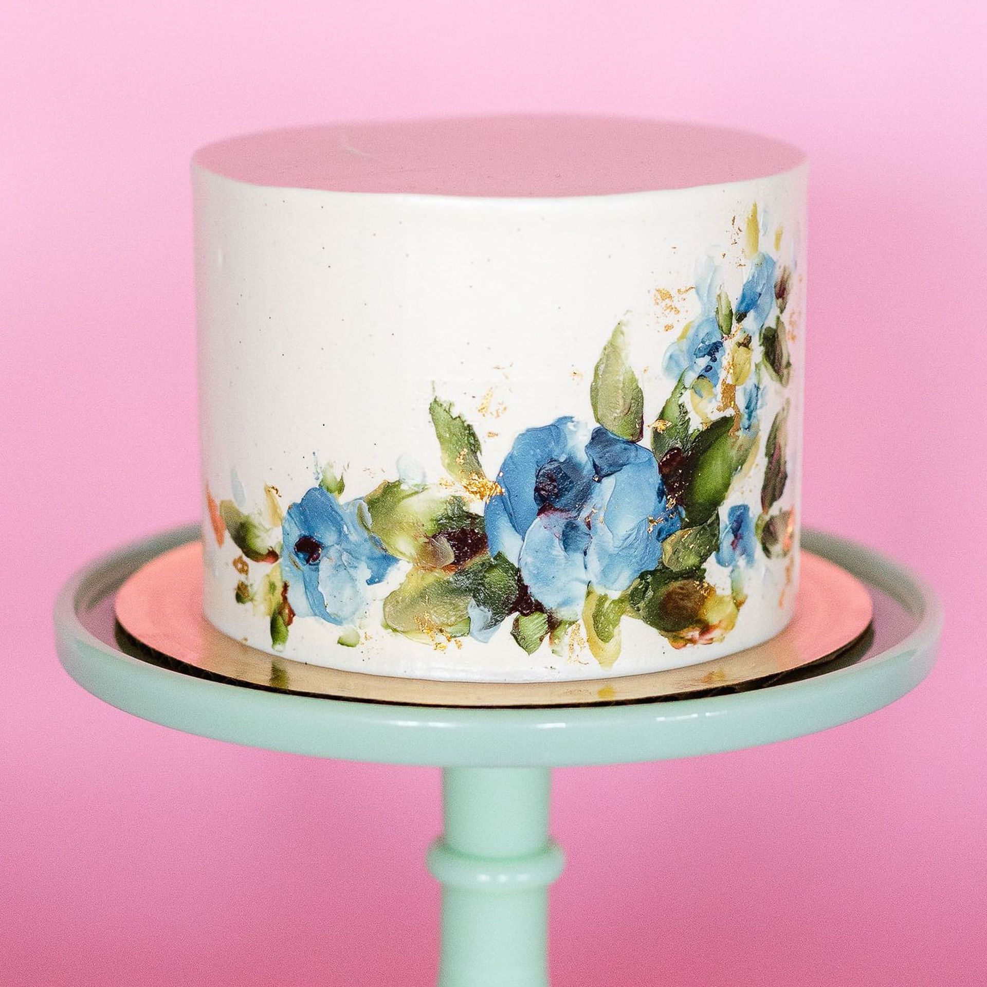 A woman in a white dress is holding a bouquet of flowers