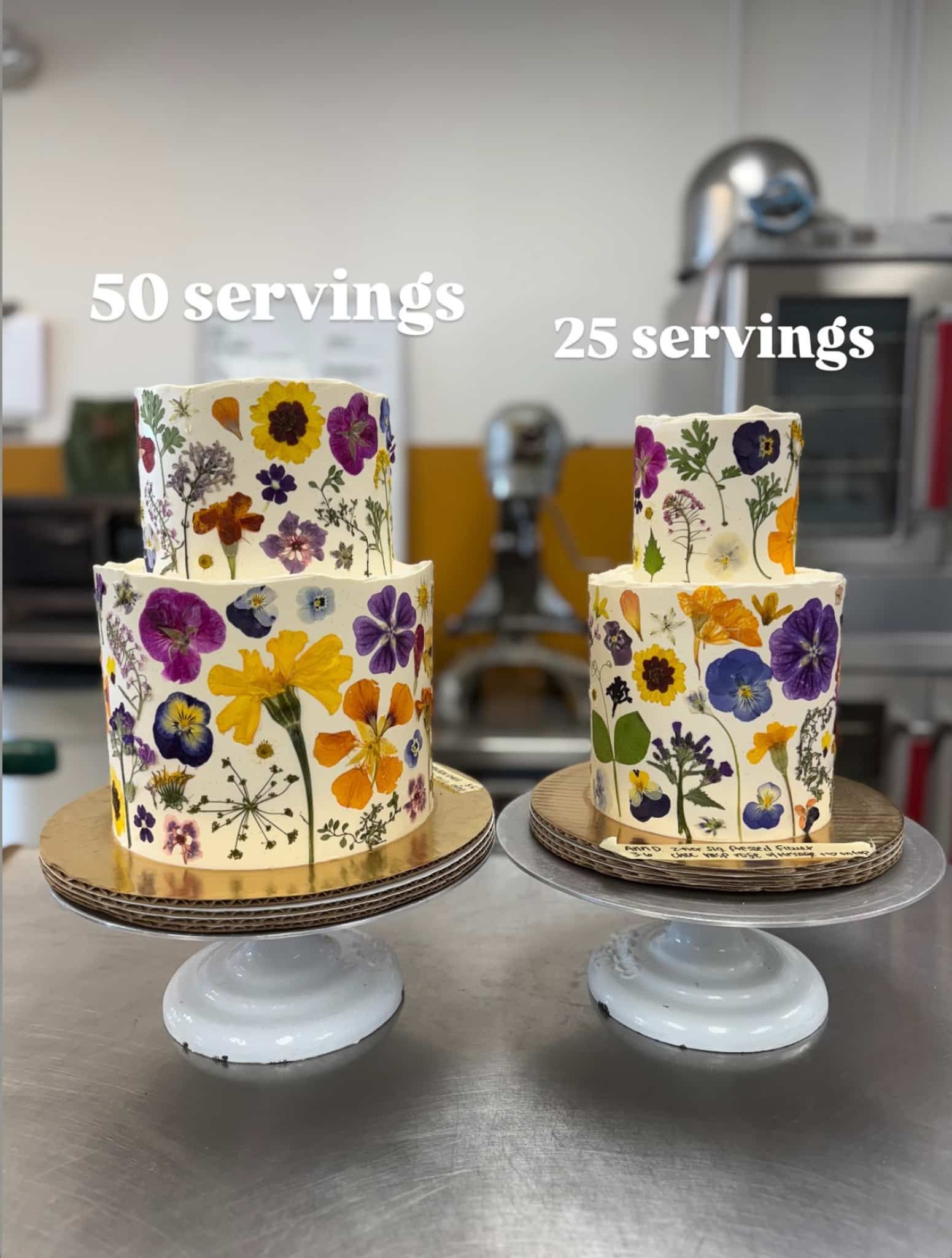 A bouquet of flowers is sitting on a table next to a chandelier.