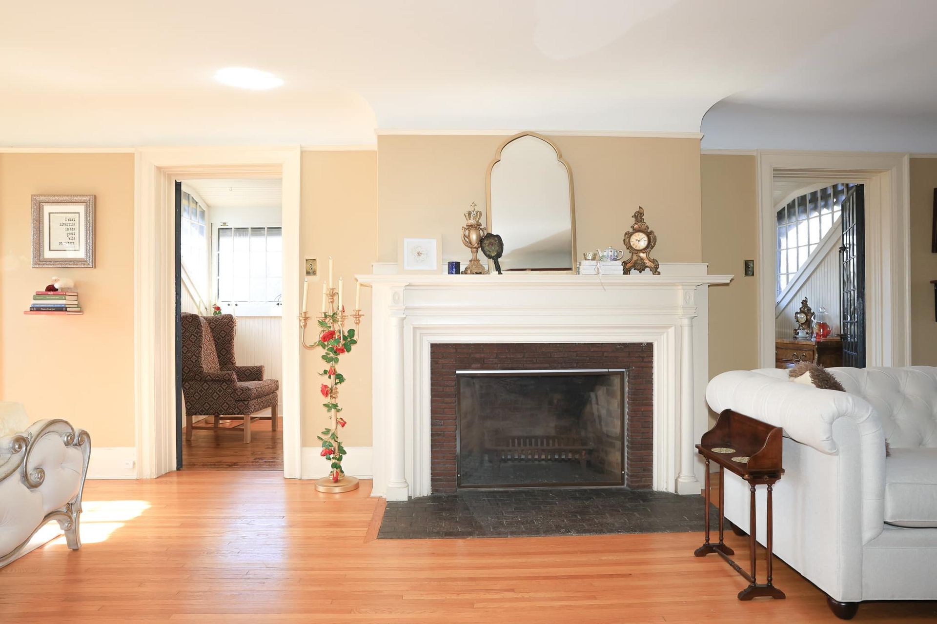 A living room with a fireplace and a white couch