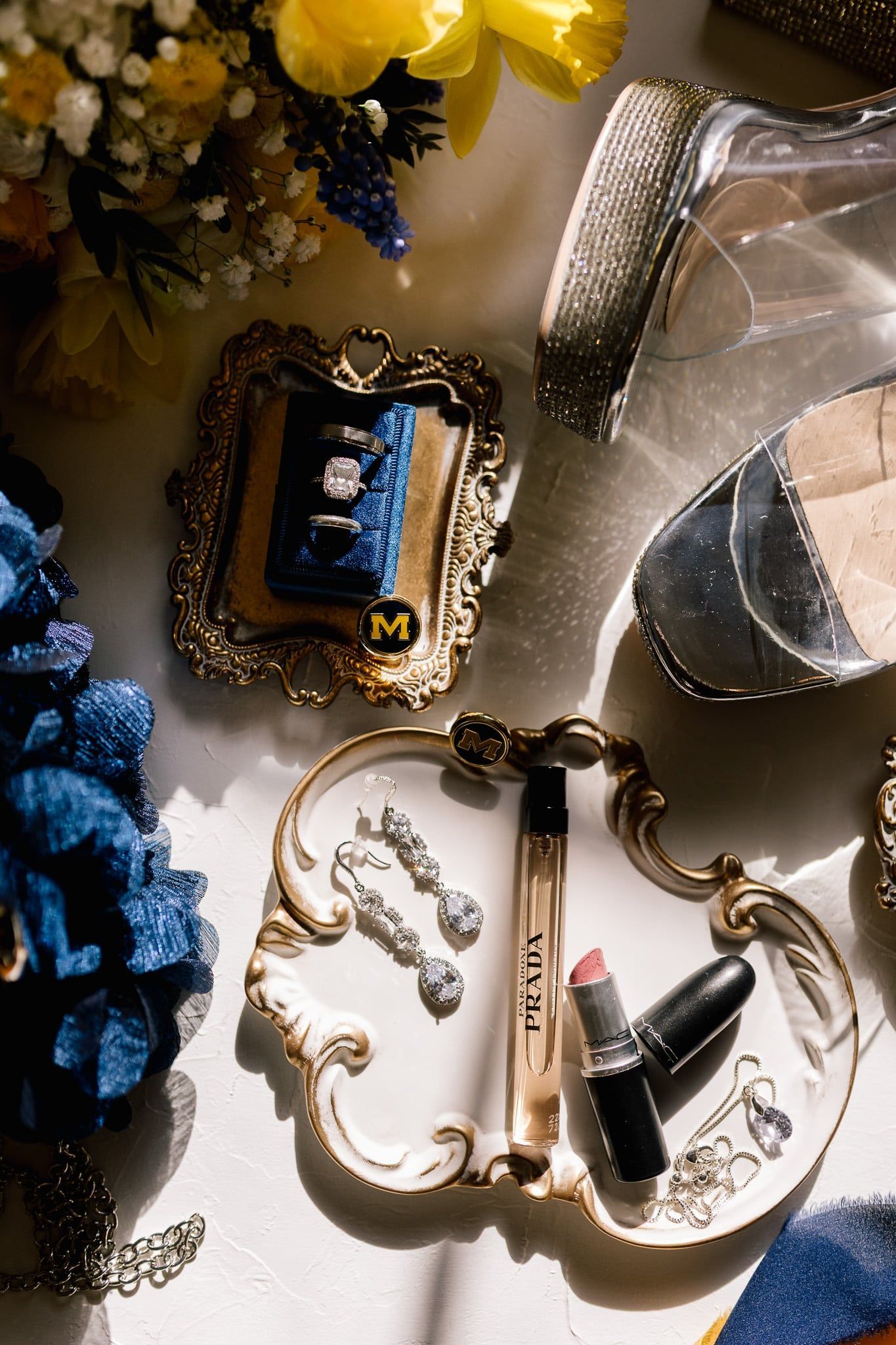 A table topped with a variety of jewelry and cosmetics