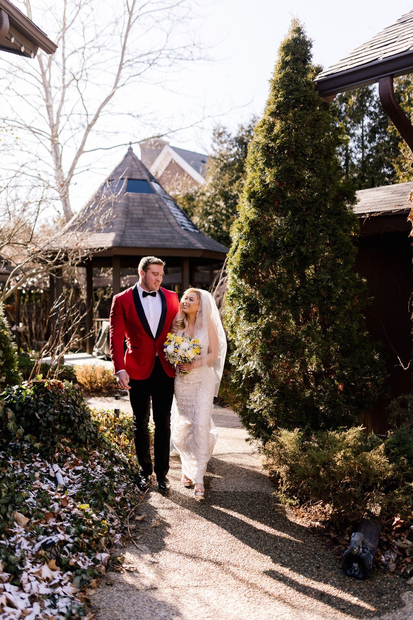A bride and groom are walking down the aisle at their wedding.
