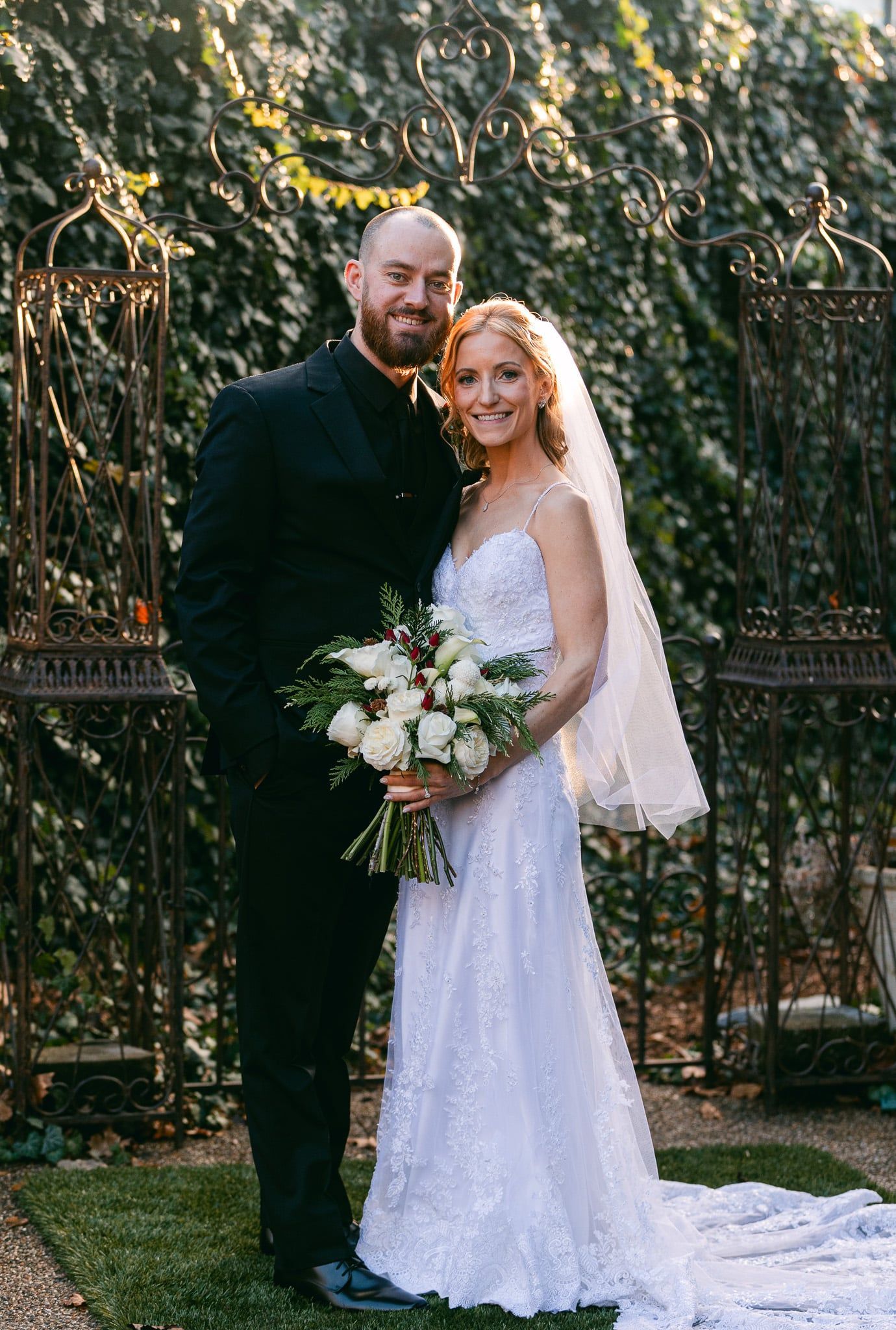A bride and groom are posing for a picture on their wedding day.