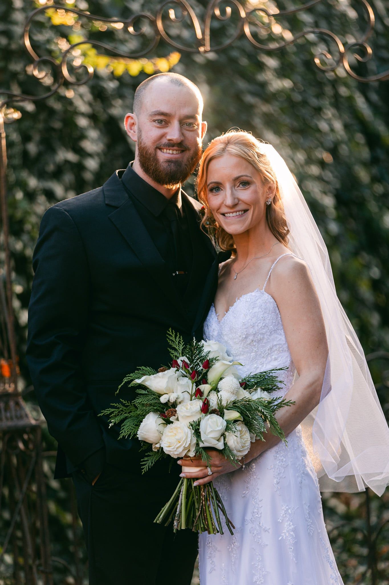 A bride and groom are posing for a picture on their wedding day.