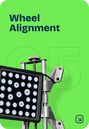 Wheel alignment service with equipment; white, green, and silver. | Cain's Auto Shop