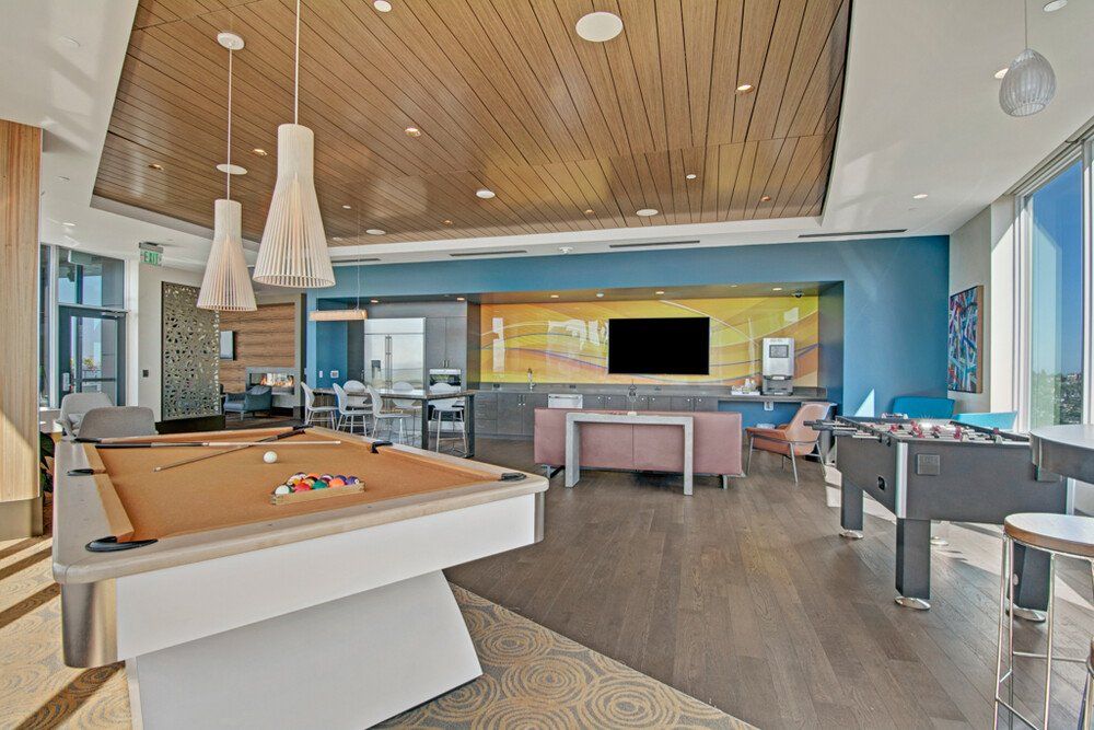 A pool table and common area at Tower12 Apartments.