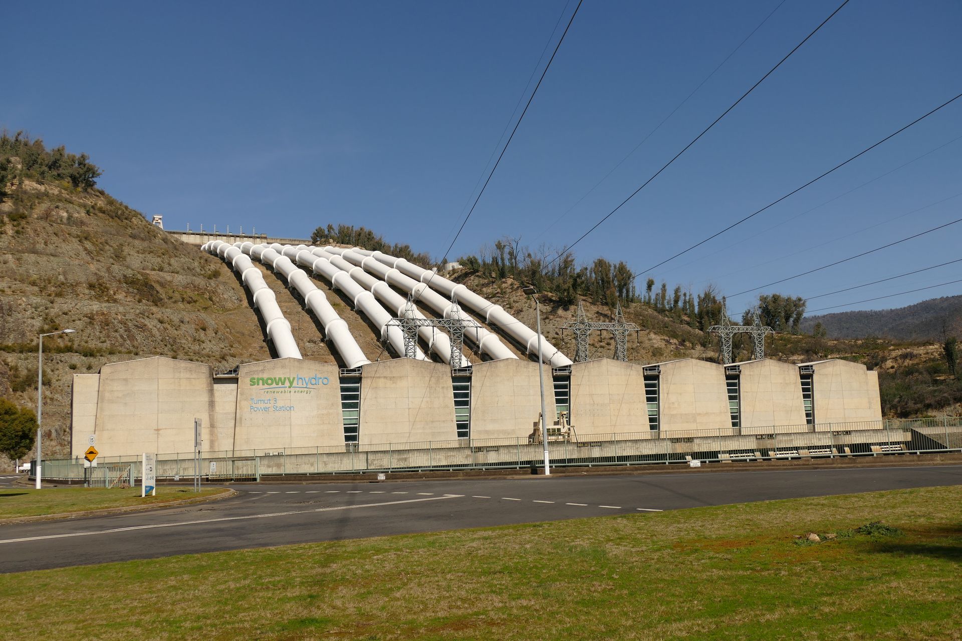 A hydro power station with large pipes entering it part of the Snowy Hydro Scheme