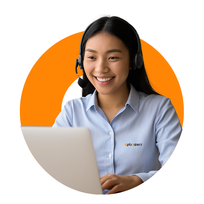 Woman with headset smiling, using a laptop, in front of an orange circle.