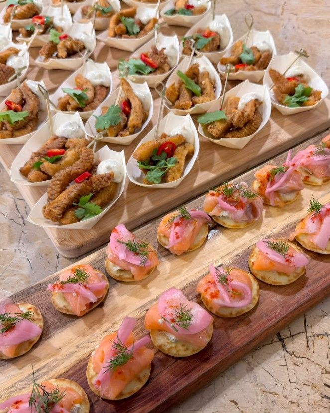 A Wooden Cutting Board Topped With a Variety of Appetizers — Darwin Catering Company in Brinkin, NT