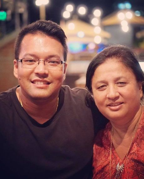 A Man and a Woman Are Posing for a Picture Together — Darwin Catering Company in Brinkin, NT