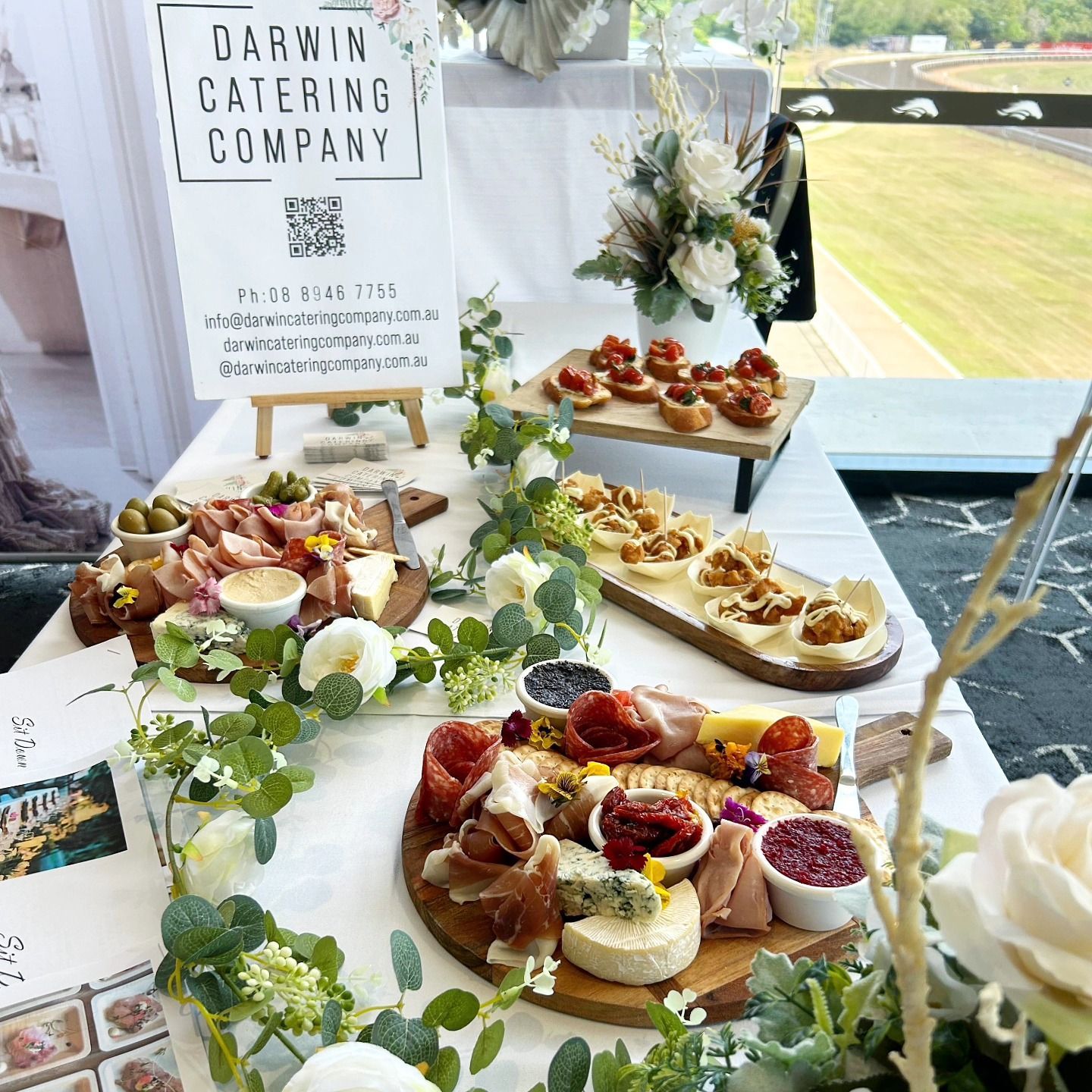 A Table With a Sign That Says Darwin Catering Company on It — Darwin Catering Company in Brinkin, NT