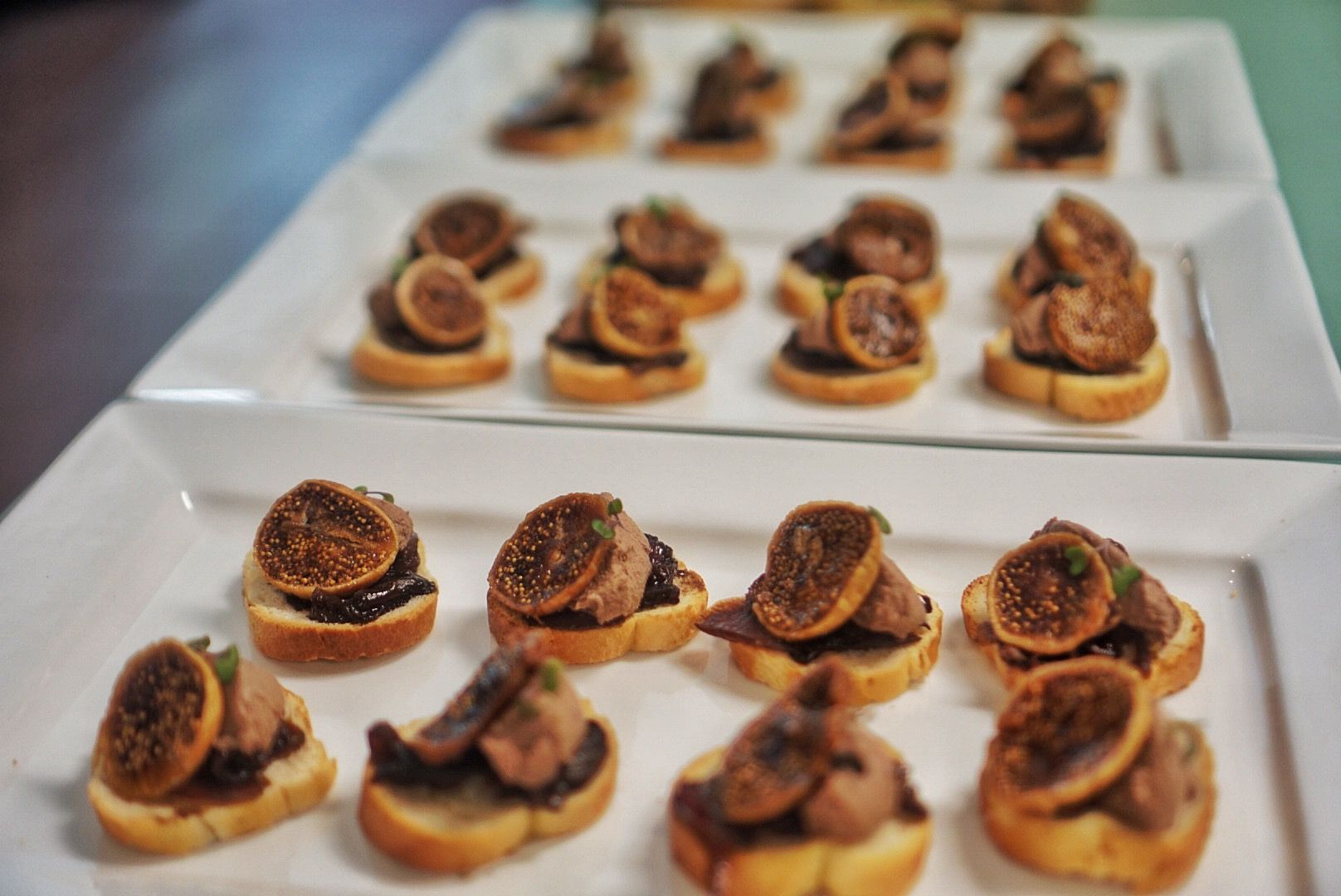 A Table With Plates and a Box of Food on It — Darwin Catering Company in Brinkin, NT