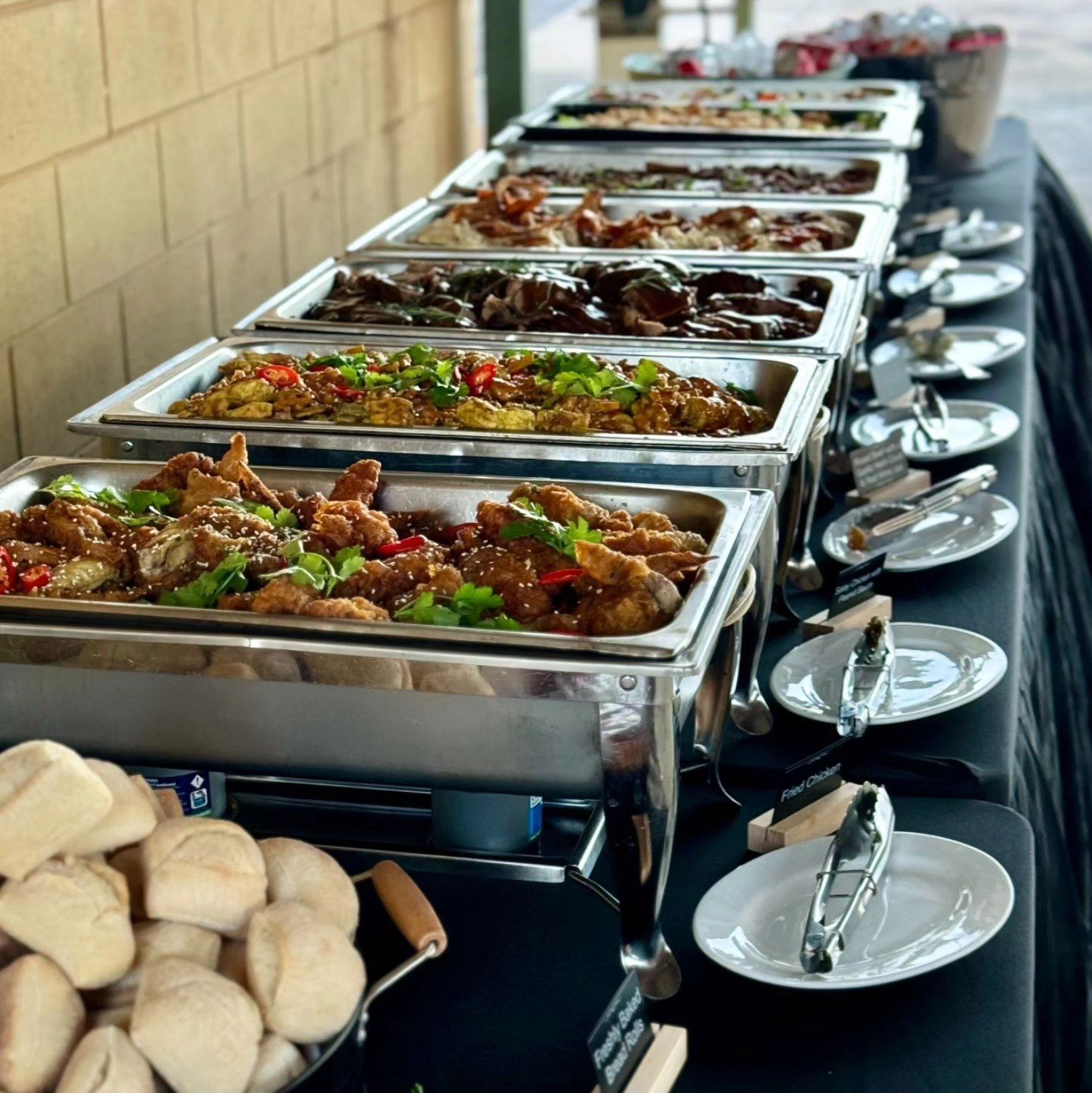 A Buffet Table With Many Trays of Food on It — Darwin Catering Company in Brinkin, NT
