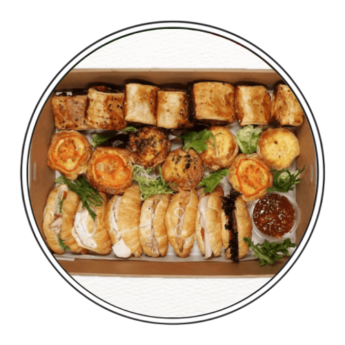 A Table Topped With platters of sliders, sushi, fruits and more — Darwin Catering Company in Brinkin, NT