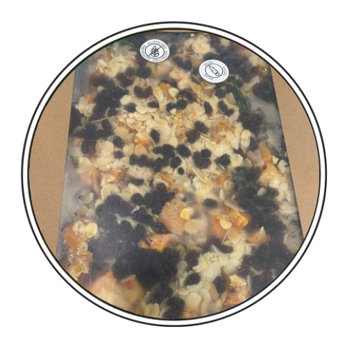 Cardboard container with Sweet Potato, Quinoa & Roasted Almonds. Food visible through plastic window — Darwin Catering Company in Brinkin, NT