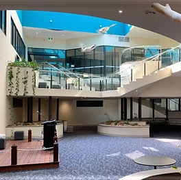 The Inside of a Building With a Balcony and Stairs — Darwin Catering Company in Brinkin, NT