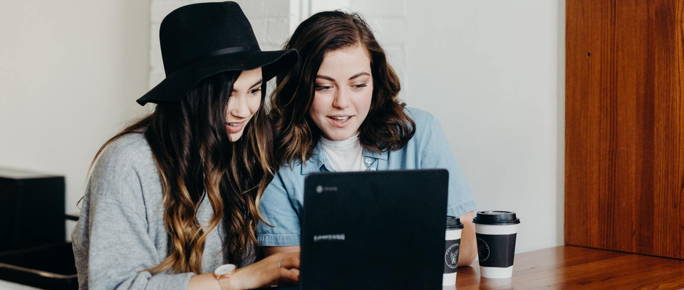 Two girls clicking around on the internet