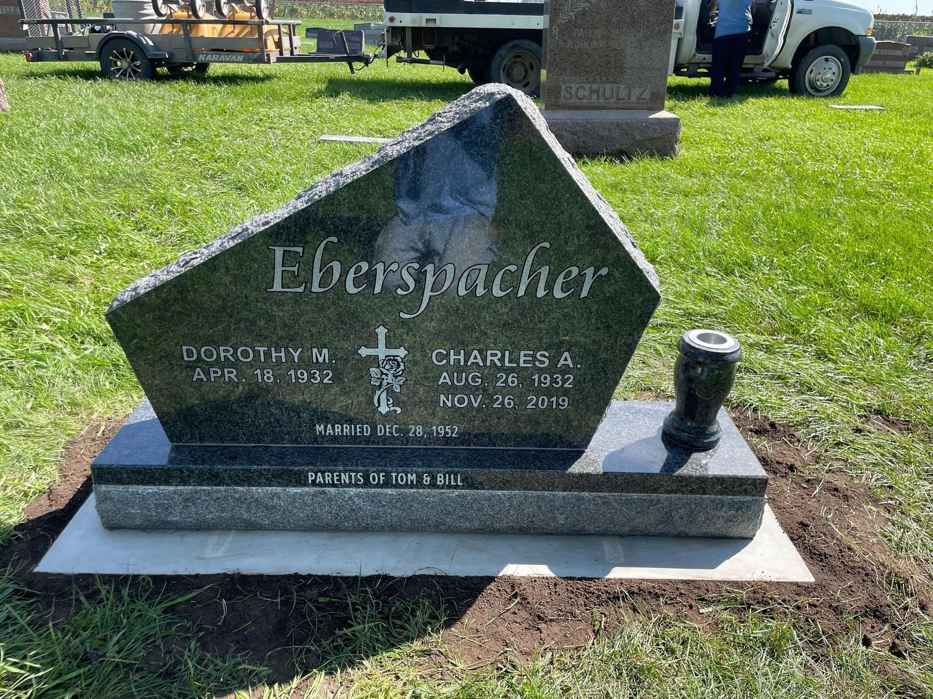 Headstone for Dorothy M. and Charles A. Eberspacher, black granite, in a cemetery.