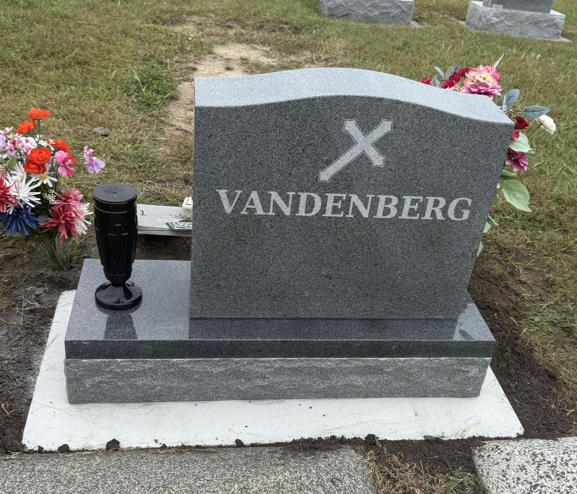 Headstone in a cemetery with the name 