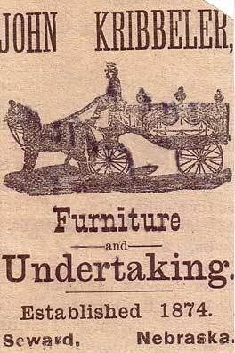 Advertisement for John Kribbeler, Furniture and Undertaking. Horse-drawn hearse, established 1874 in Seward, Nebraska.