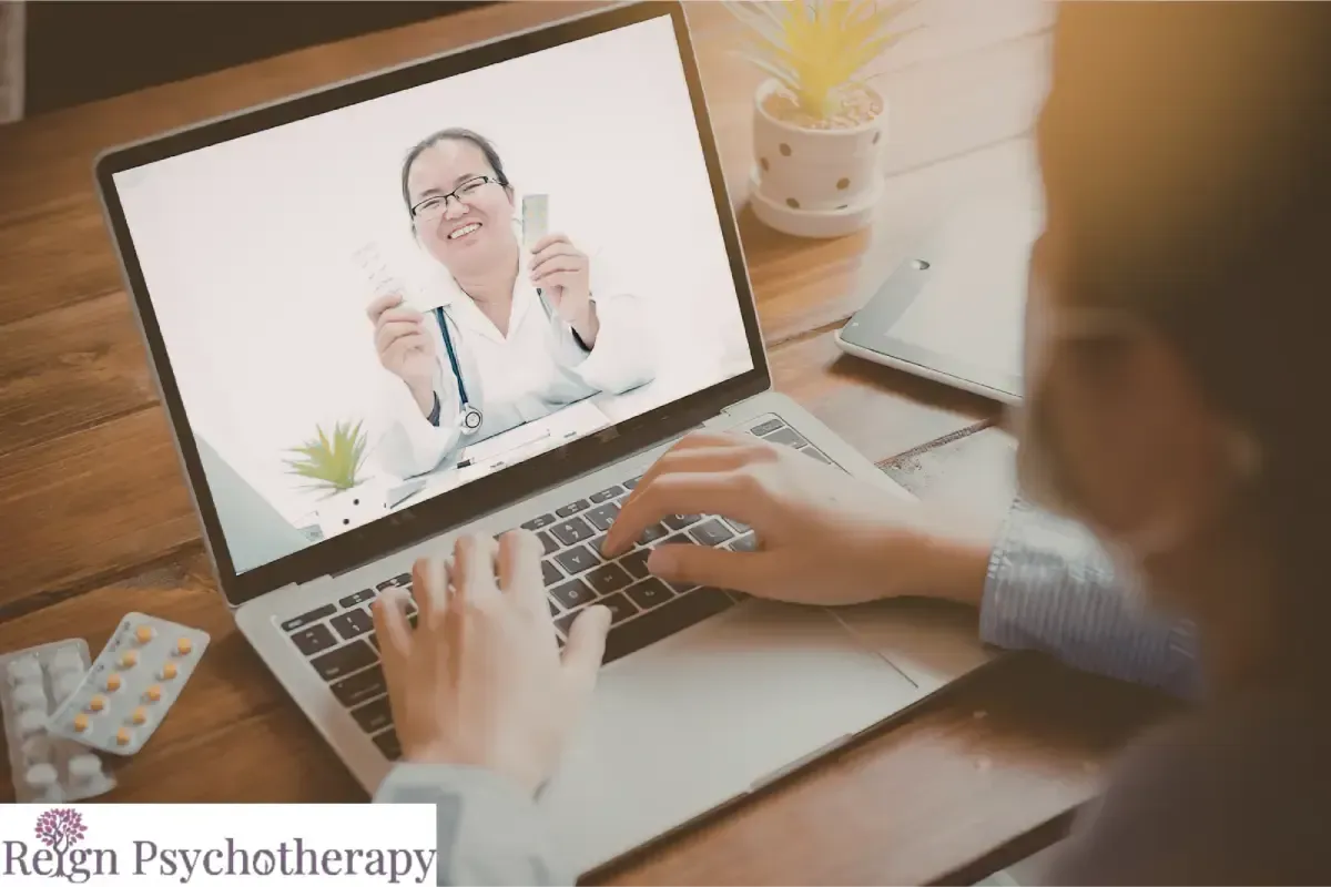 A person uses a laptop for a virtual medical consultation.
