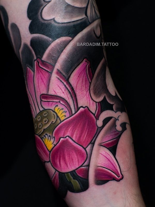 A tattoo of a lotus flower on a person 's arm