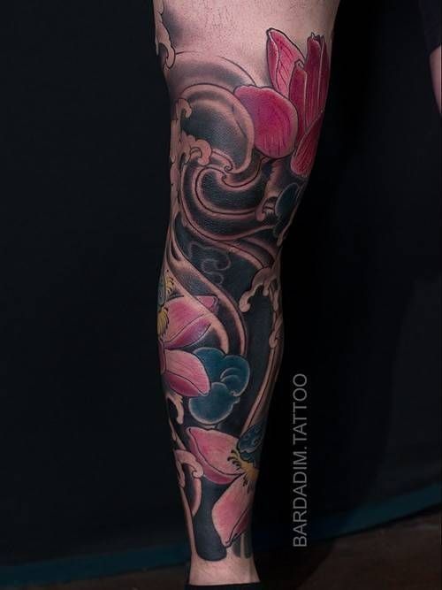 A tattoo of a lotus flower on a person 's leg.