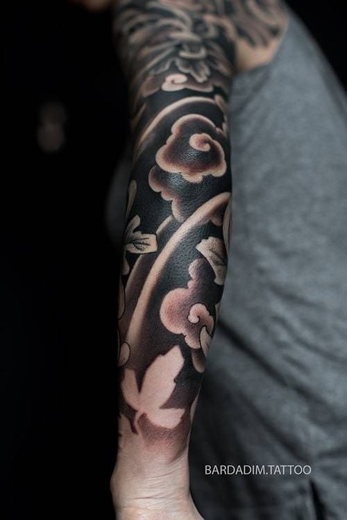 A person has a tattoo on their arm that says barroad tattoo