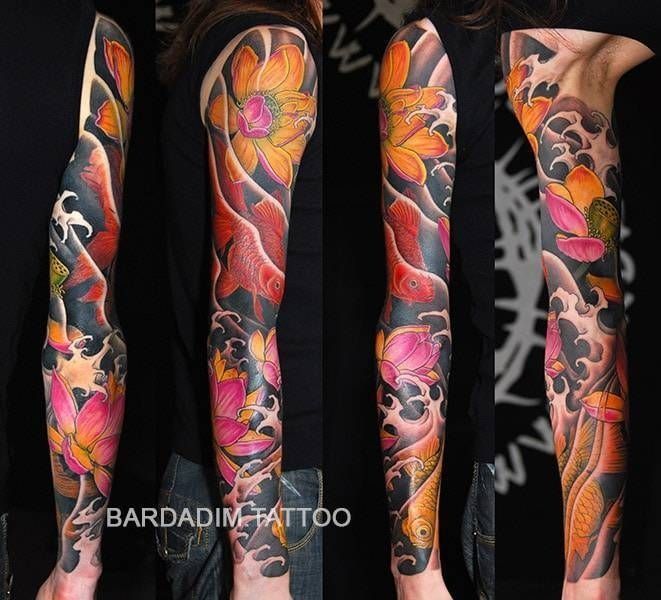 A woman has a full sleeve tattoo of flowers and waves