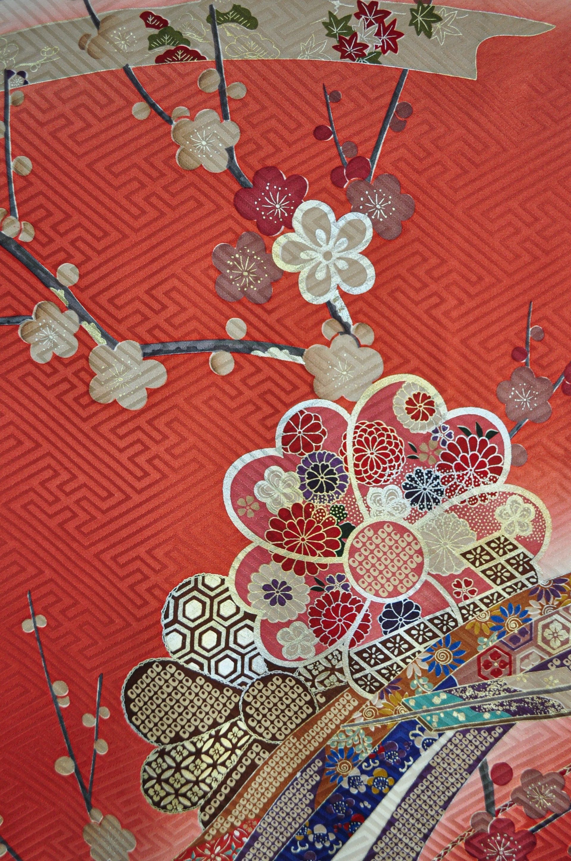 A close up of a floral pattern on a red background