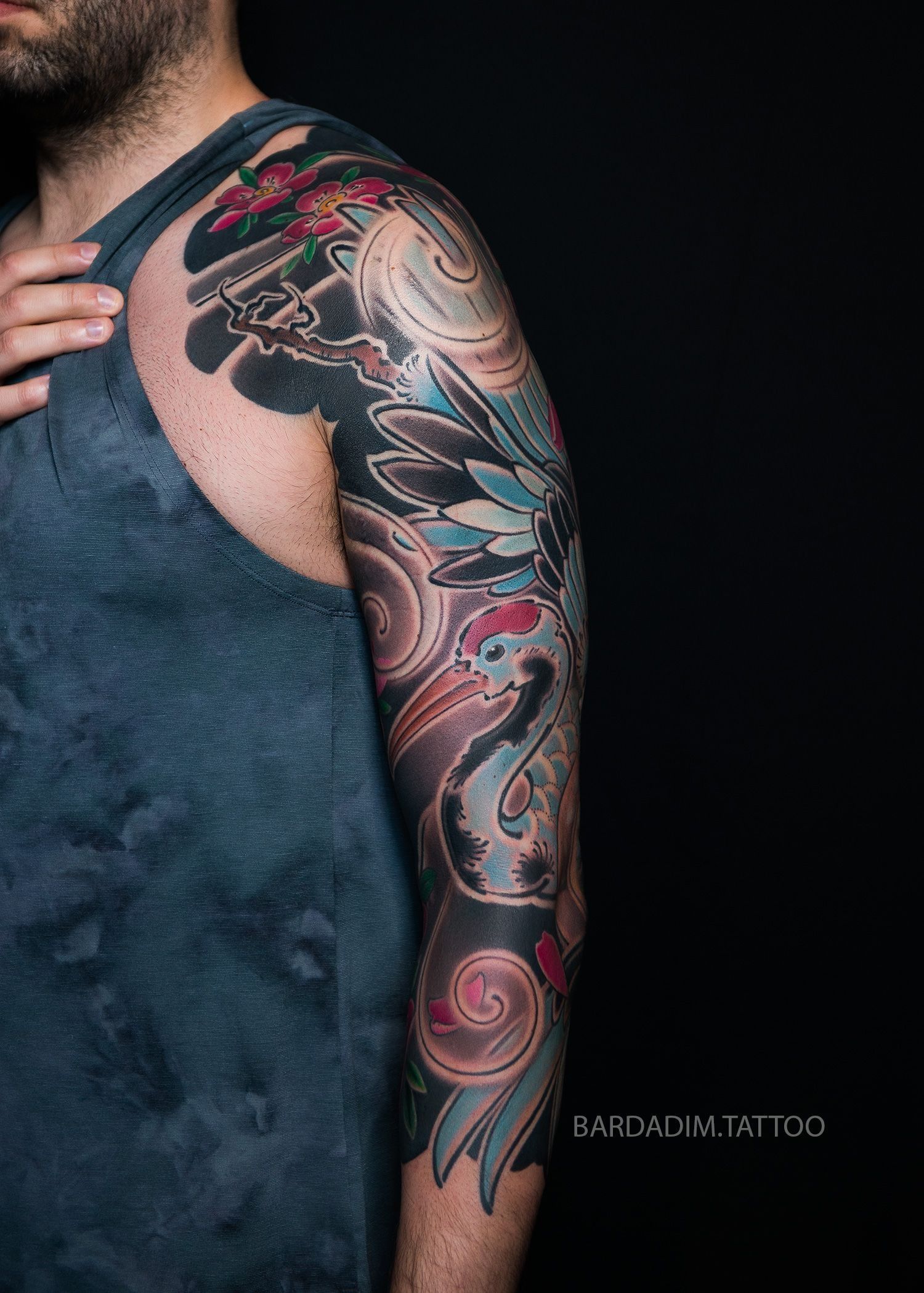 Japanese 3/4 sleeve tattoo featuring crane in flight and wave composition by Bardadim Tattoo Studio