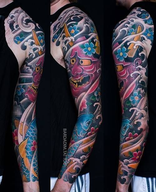 A man has a full sleeve tattoo on his arm