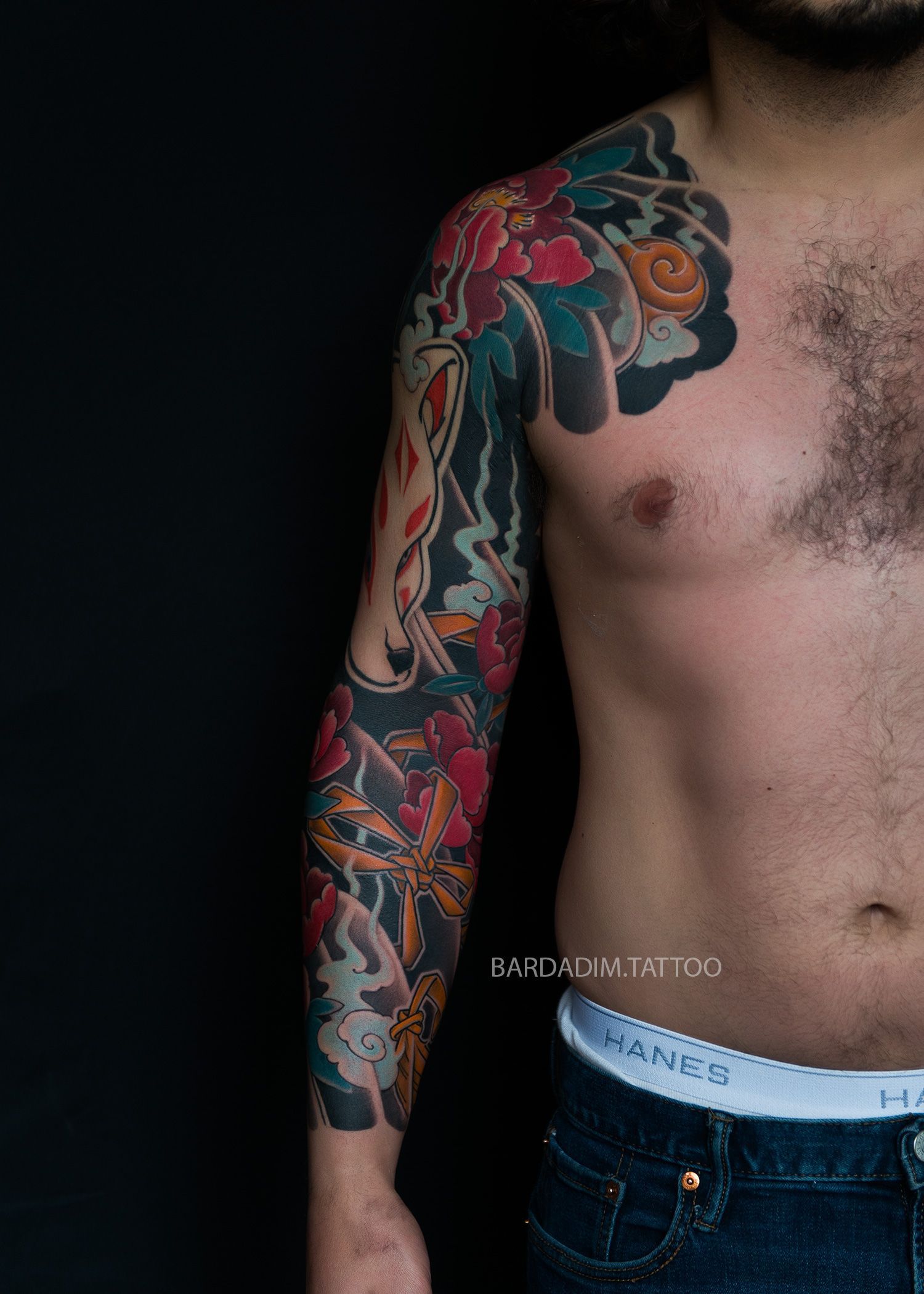 Traditional Japanese kitsune mask and peony tattoo sleeve, chest and arm view, classic irezumi flow