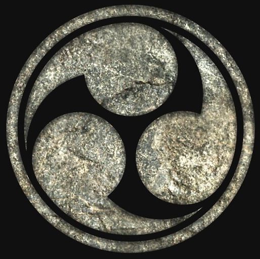 A symbol with three circles in a circle on a black background