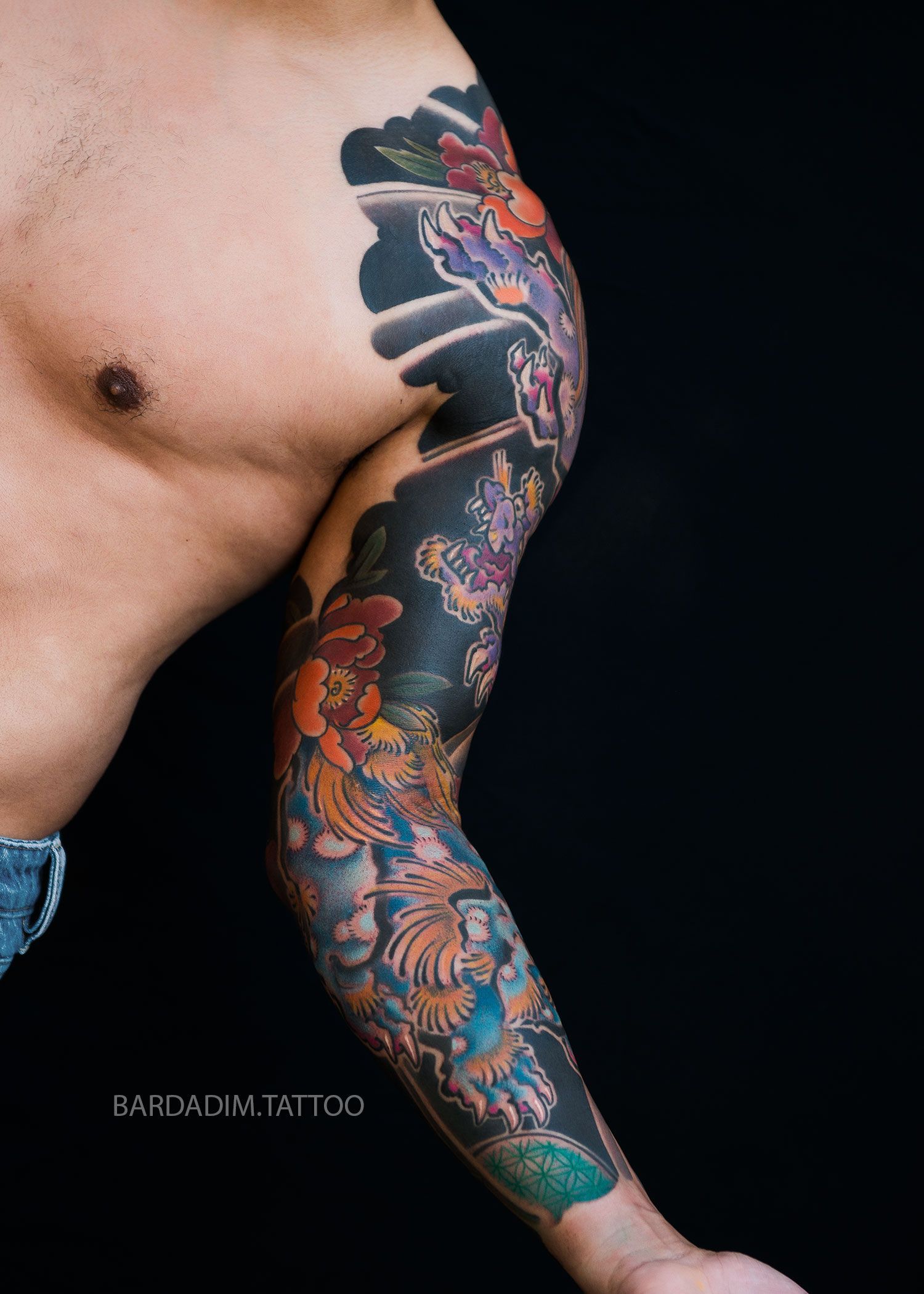 Inner section of Japanese full sleeve tattoo featuring peonies and Shishi Lions in vibrant Gaku-bori style by Bardadim Tattoo.
