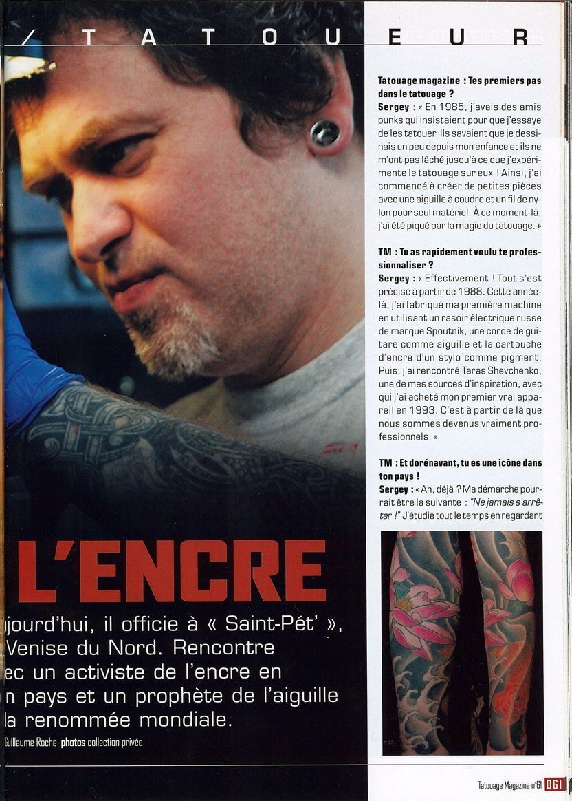 A magazine opened to a page that says l' encre