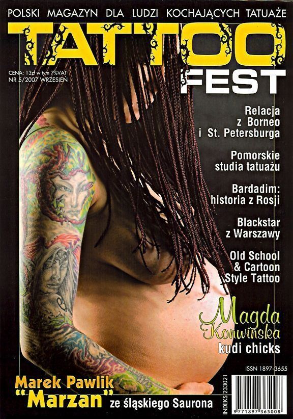 A pregnant woman with tattoos is on the cover of a magazine called tattoo fest