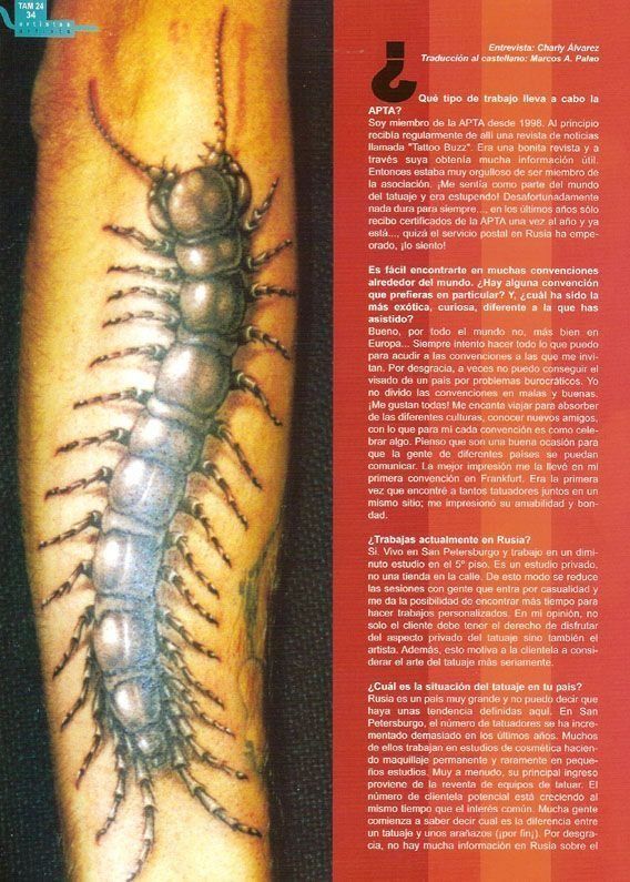 A person has a tattoo of a centipede on their arm