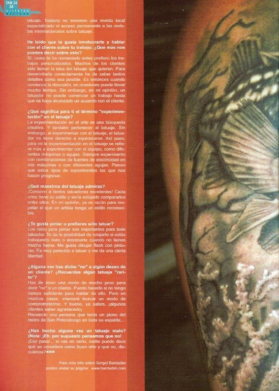 A page of a magazine with a tattoo on a person 's arm